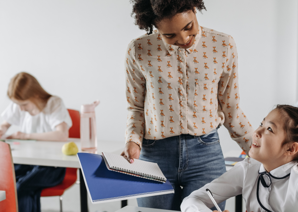 An educator helps a child catch up on reading and math to prevent a widening skills gap in the future.