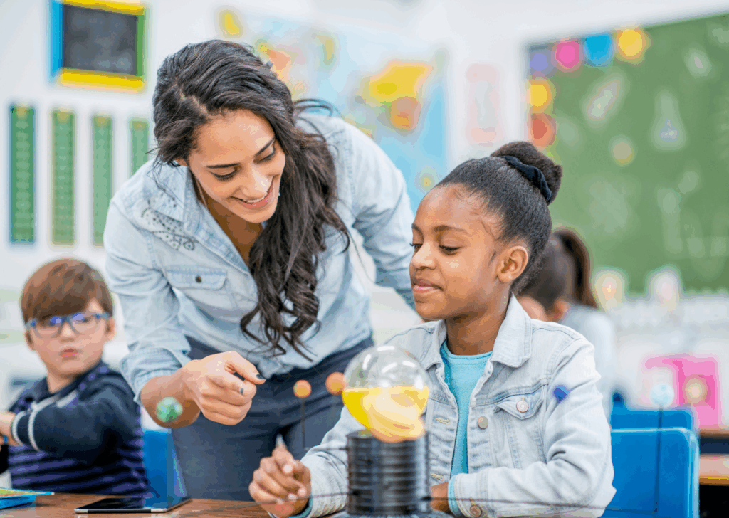 A teacher assists a student in applying math skills to a science project.