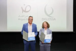 Eyad Darawsheh, General Manager of Arabic Scale Educational Consultancy LLC, and Mimi Jett, Founder and CEO of Diglossia, display the partnership agreement that will integrate the Miqyas Al Dhad reading scale into Diglossia's digital literacy and assessment platforms. Image Courtesy: Miqyas Al Dhad