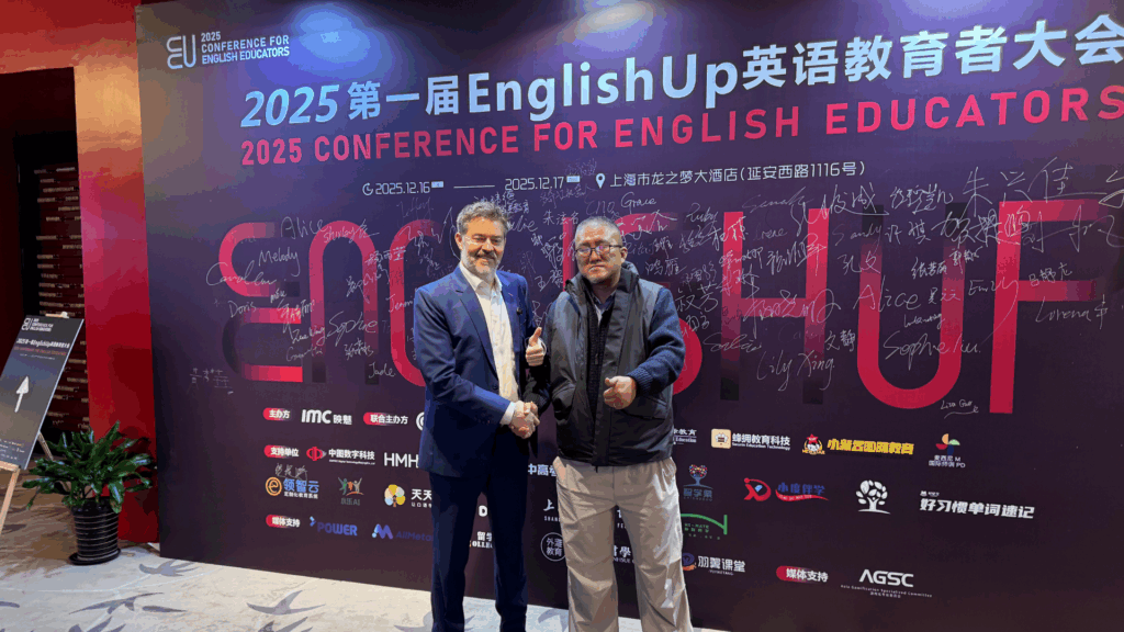 Andy Shafran, Founder and CEO of Blue Heron Consulting greets the founder of the EnglishUp Conference in Shanghai, China.